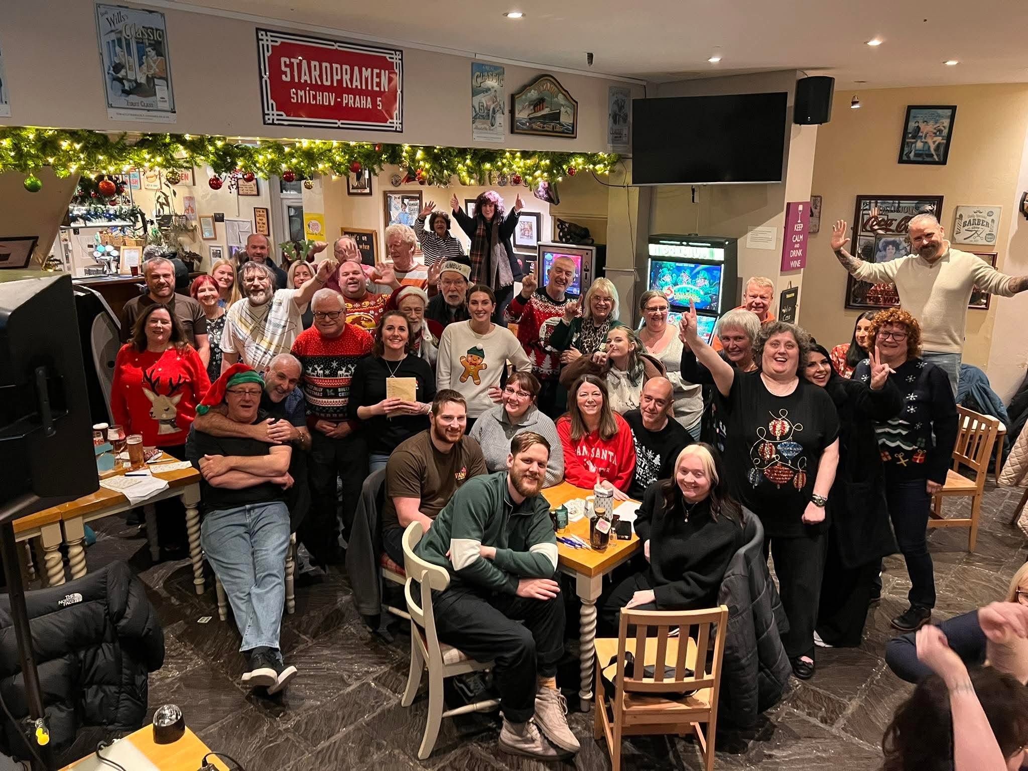 A festive gathering of regulars inside The Olde Trout Tavern